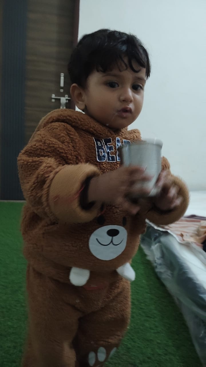 Toddler holding cup